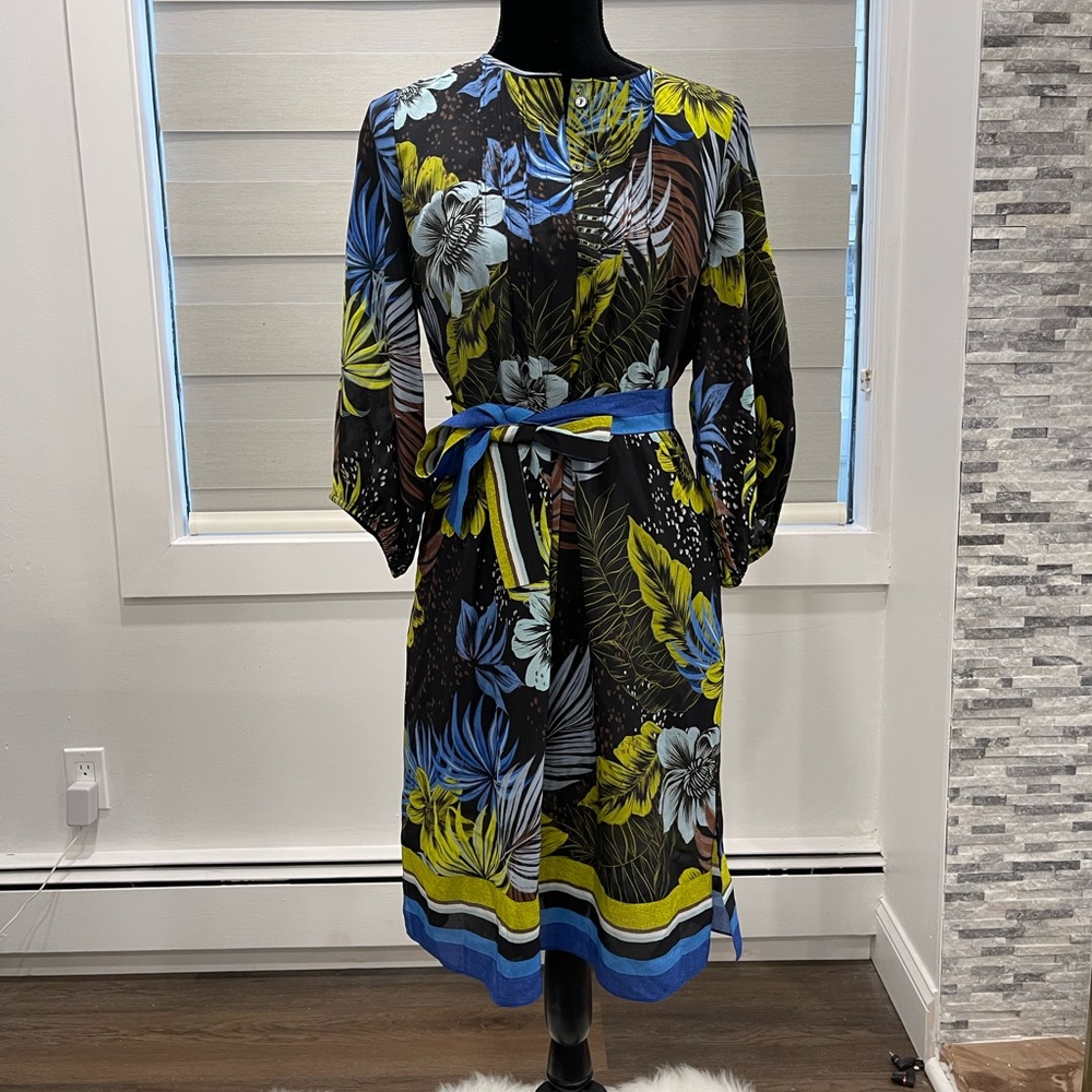 Crafted of sumptuous silk, the Celine shirtdress is classically styled
